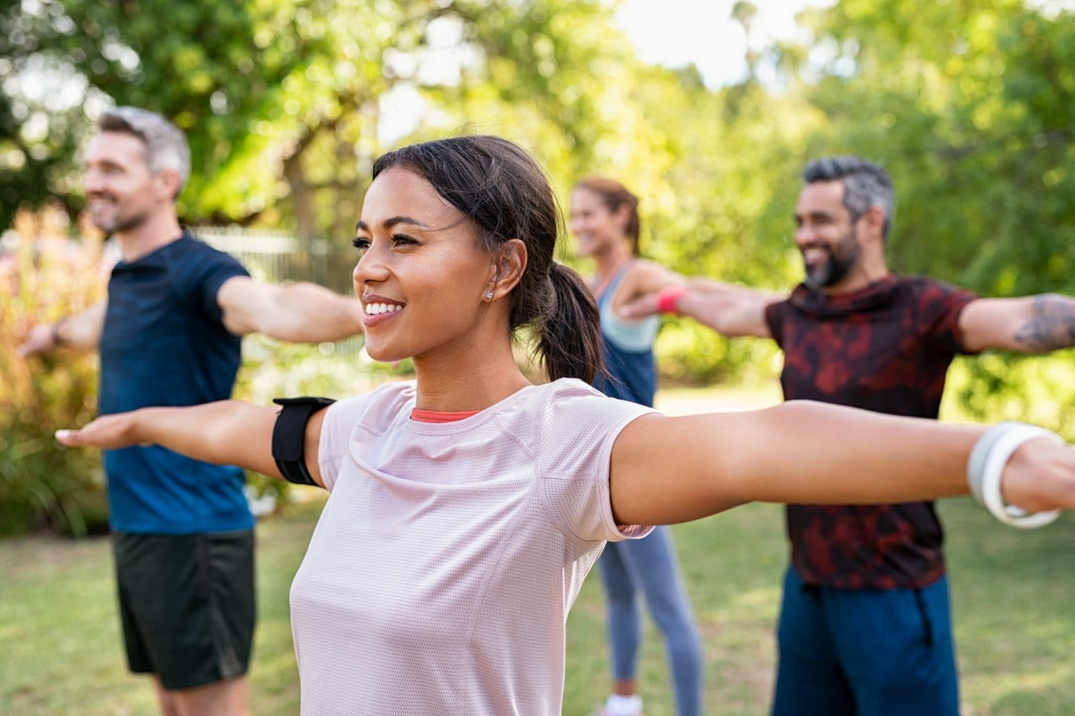 Group of people exercising in the park 